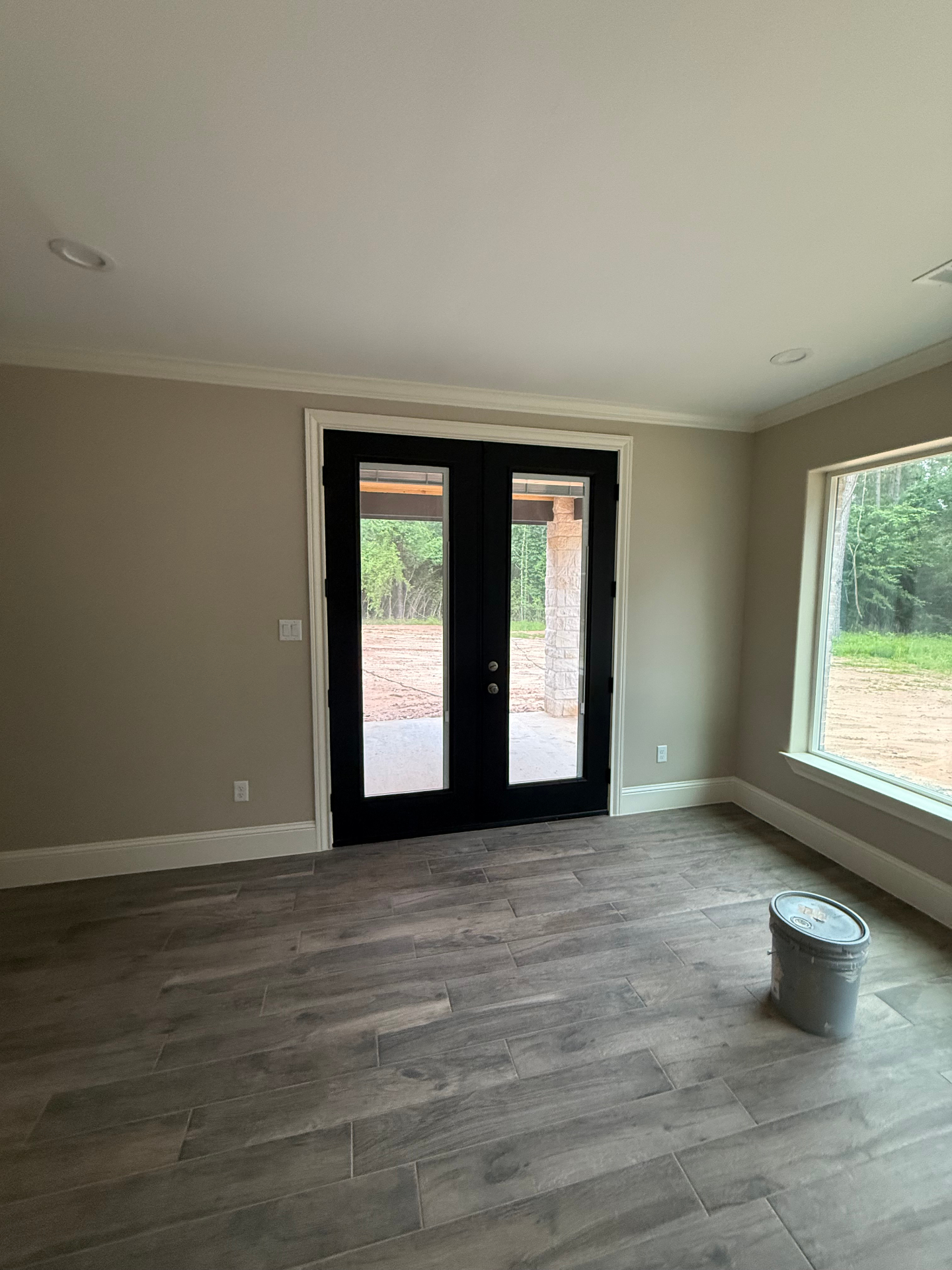 Interior room with black French doors leading outside
